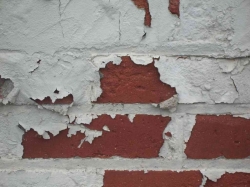 Flaking Paint Leaves Brick Exposed